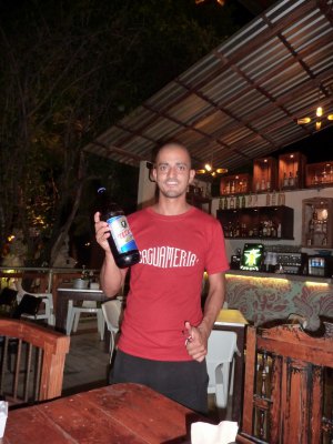 Caguameria waiter holding Tecate beer